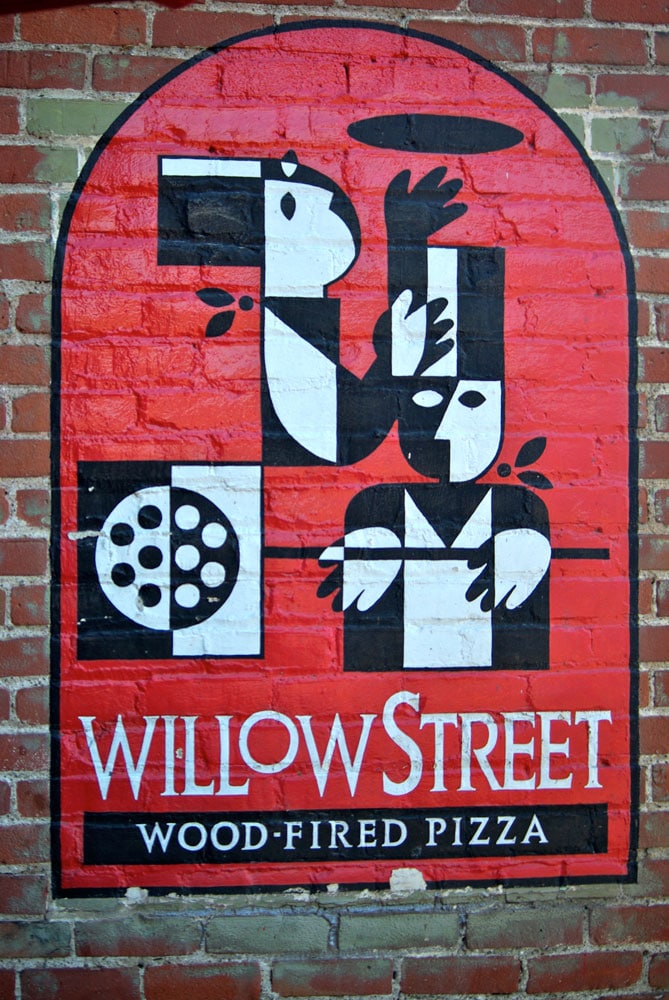 contact us; the willow street logo on outside of brick building